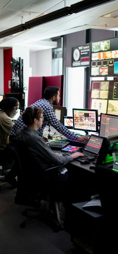 man in black and white checkered dress shirt sitting on black office rolling chair